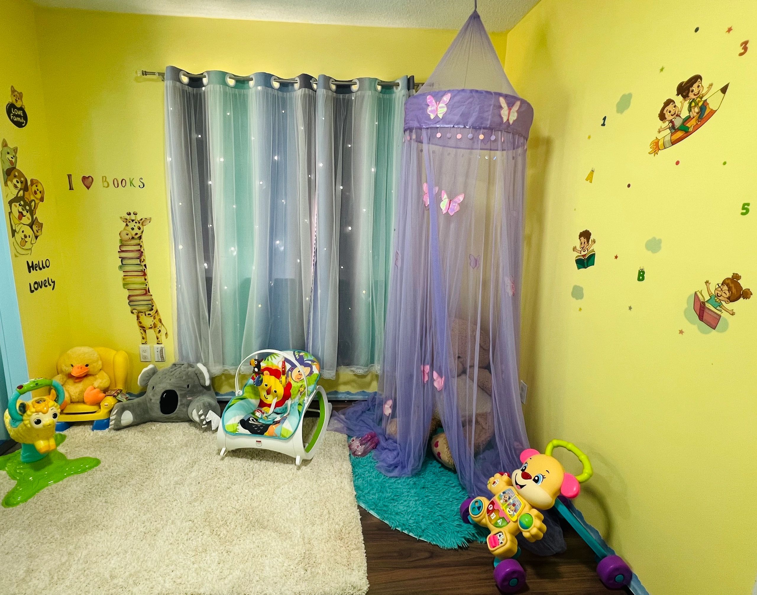 Colorful and cozy children's playroom with toys and wall decorations.