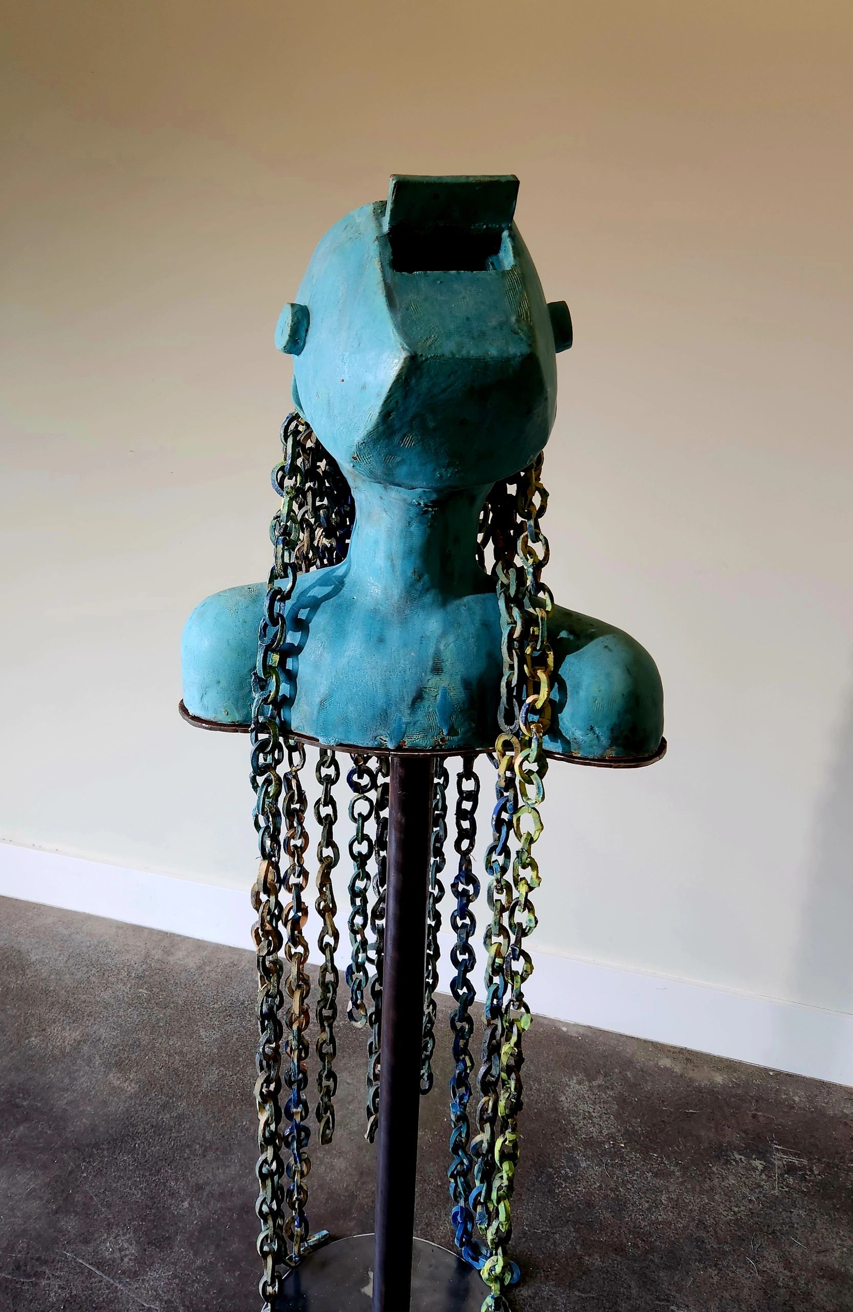 Life-sized ceramic sculpture depicting a welder. Abstract.