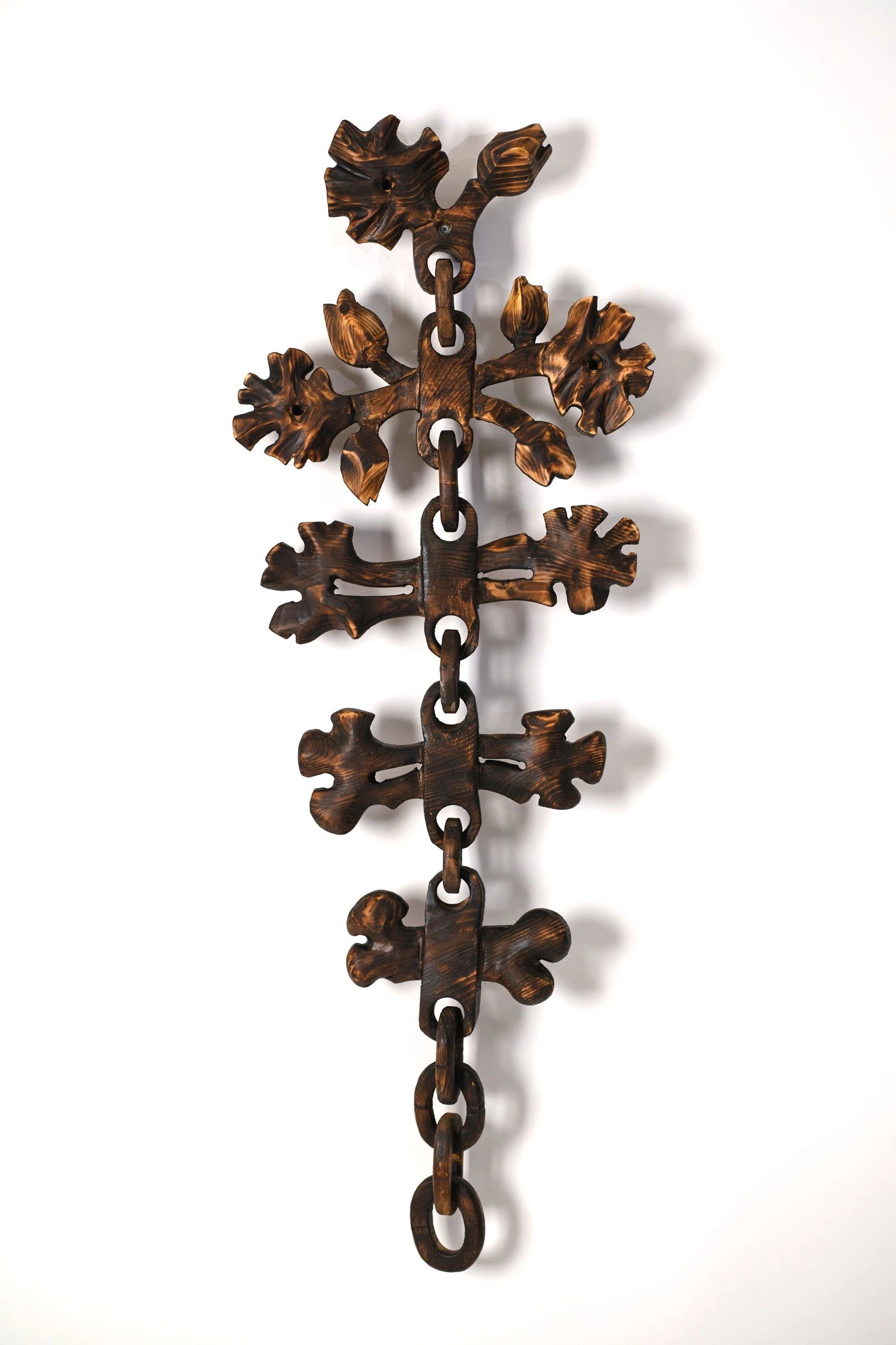 Carved wood wall sculpture.