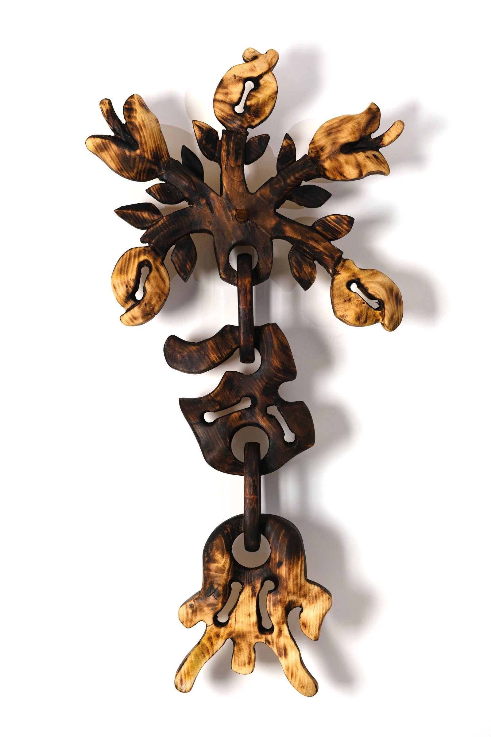 Carved wood wall sculpture.