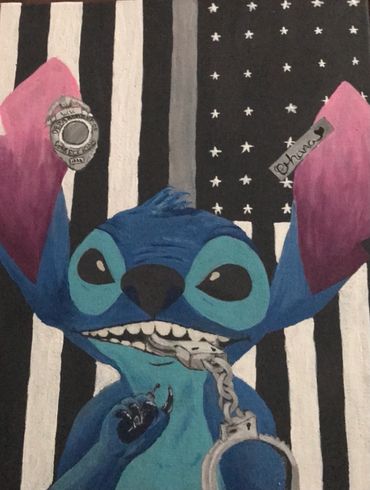 Stitch holding handcuffs in front of thin silver line flag
