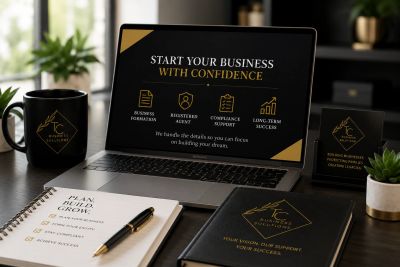 A professional workspace promoting business confidence with branded materials and a laptop display.