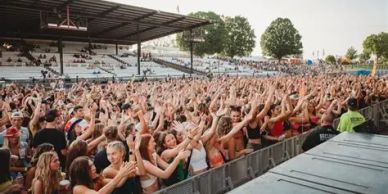 Large crowd at an outdoor concert.