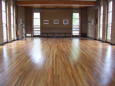 School Hall Hardwood Floor Restored by Sanding and finished with commercial water based lacquer