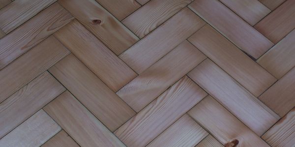 Reclaimed pitch pine wood blocks, machine sanded, barrier sealed and coated with water based lacquer