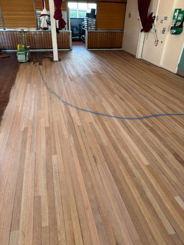 Keruing Hardwood Strip floor fully machine sanded with old coating and polish build up removed 