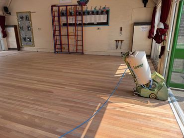 Lagler Hummel Machine being used to professionally machine sand a Keruing Solid Strip Hardwood Floor