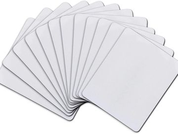 A group of whit mouse pads on a white background. 