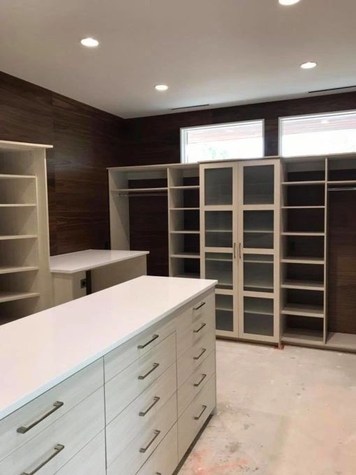 master bedroom closet with custom isla