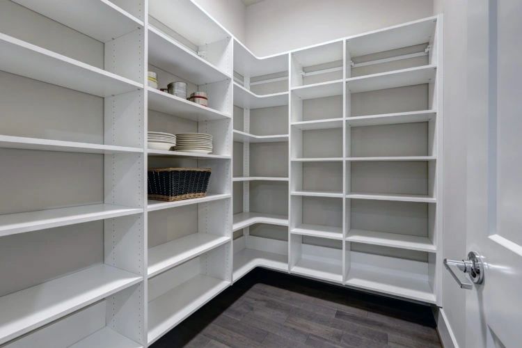empty pantry interior with white shelve