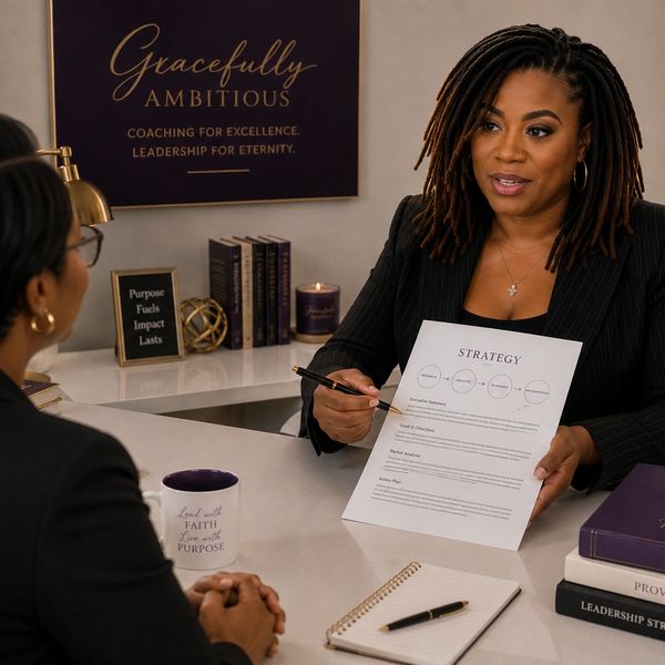 Two women discussing strategy in an office setting.