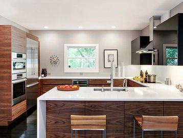 Amenities Page. A moder and very contemporary kitchen. White & gray with horizontal wood finish.