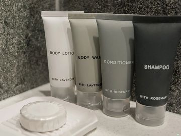Amenities Page. Generic hotel-inspired toiletries. Shampoo, Conditioner, Body Wash, Lotion and soap.