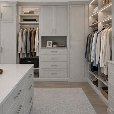 Bright modern walk-in closet with custom cabinetry, shelving, hanging space, and drawers.