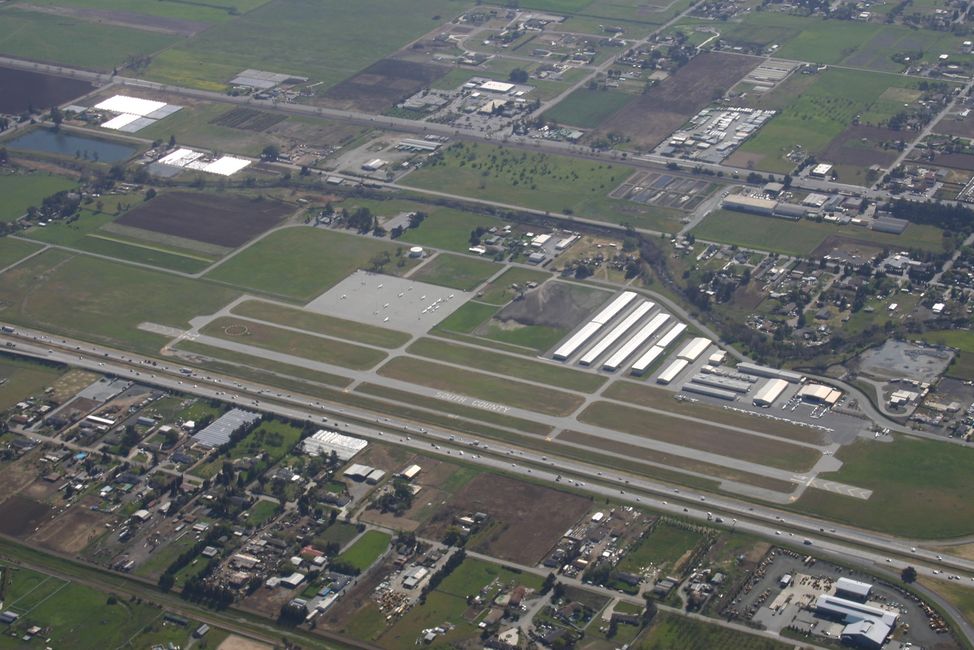 Aerial picture of San Martin Airport (E16), runways, taxiways, along Hwy 101, Santa Clara County.