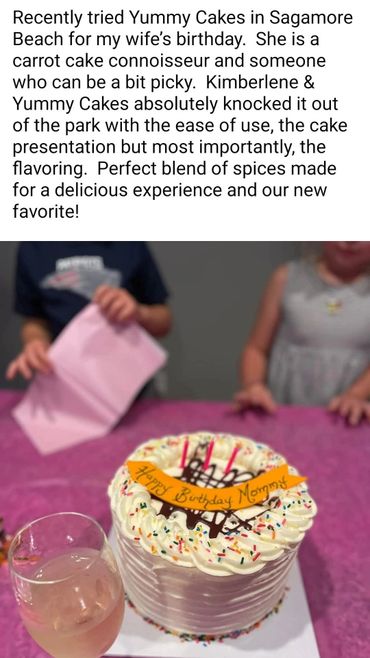 A beautifully decorated birthday cake with colorful sprinkles and candles on a pink tablecloth.