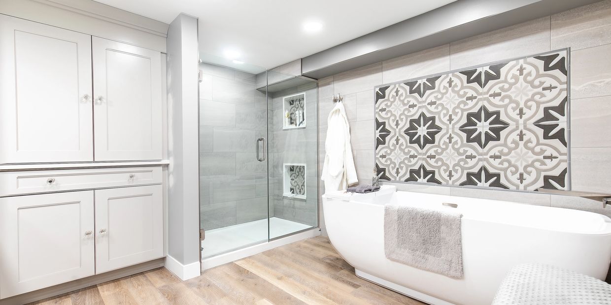 Modern bathroom with a glass shower and freestanding bathtub.