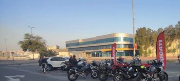 Line of motorcycles parked in a row.