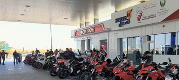Ducati Emirates fuel stop - many different Ducati models parked