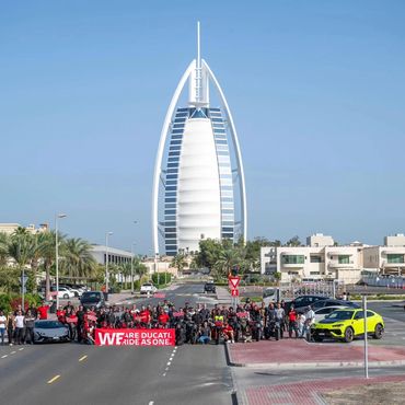 Ducati DOC UAE group picture together with Lamburghini UAE with the iconic Burj Al Arab Hotel