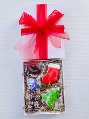 Holiday-themed gift box with festive treats.