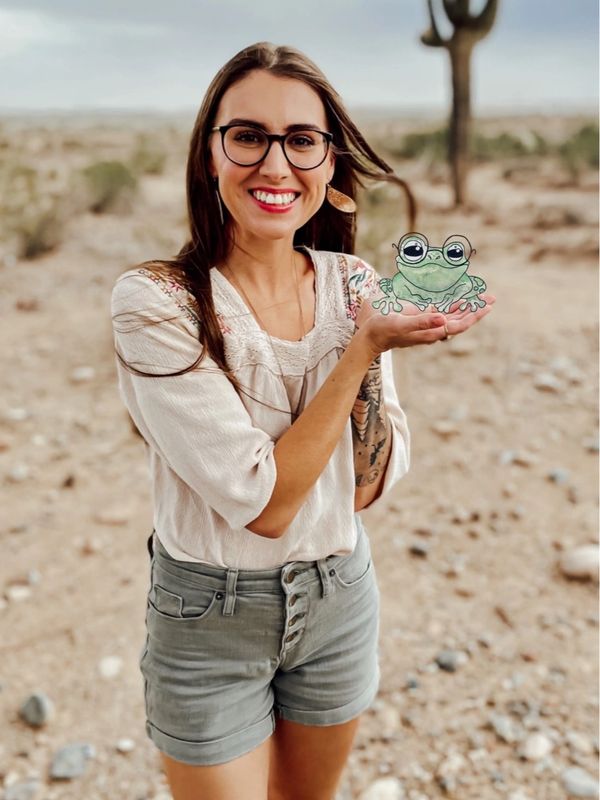 artist holding painted toad