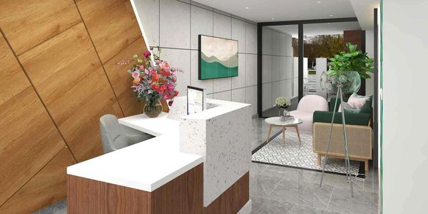 Recepción moderna con decoración elegante y ventanas grandes.