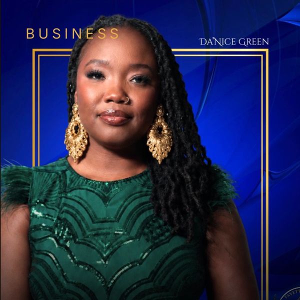 Confident businesswoman in green dress with gold earrings.