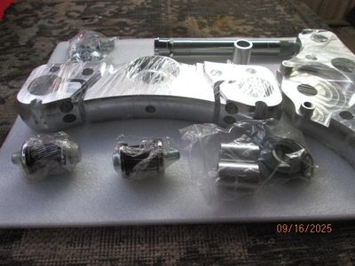 Mechanic installing aftermarket Yaffe parts on Harley in TX.