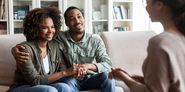 Image of young black couple during marital counseling