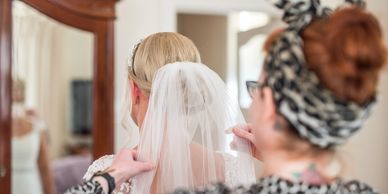 image of bride wearing veil - Norfolk wedding planning including all the details 