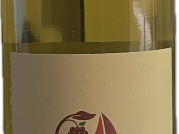 Wine bottle label with grape and sailboat design.