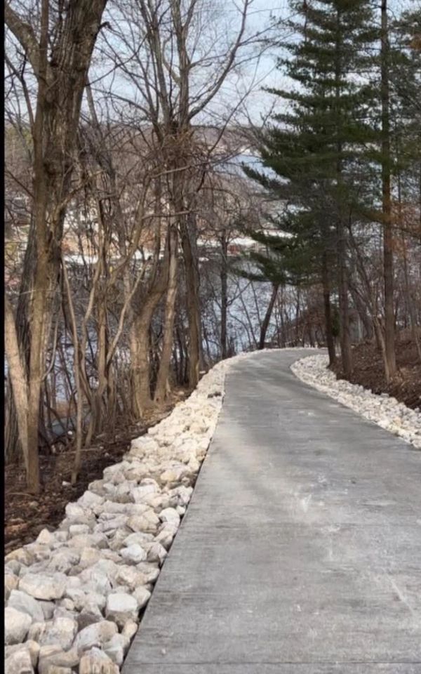 After installation of proper drainage and rip rap to increase both curb appeal and function 