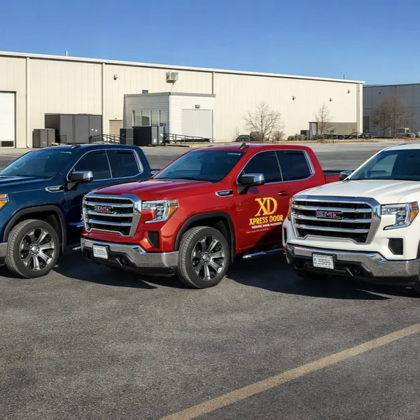 Xpress Door garage door trucks in red, white and blue.