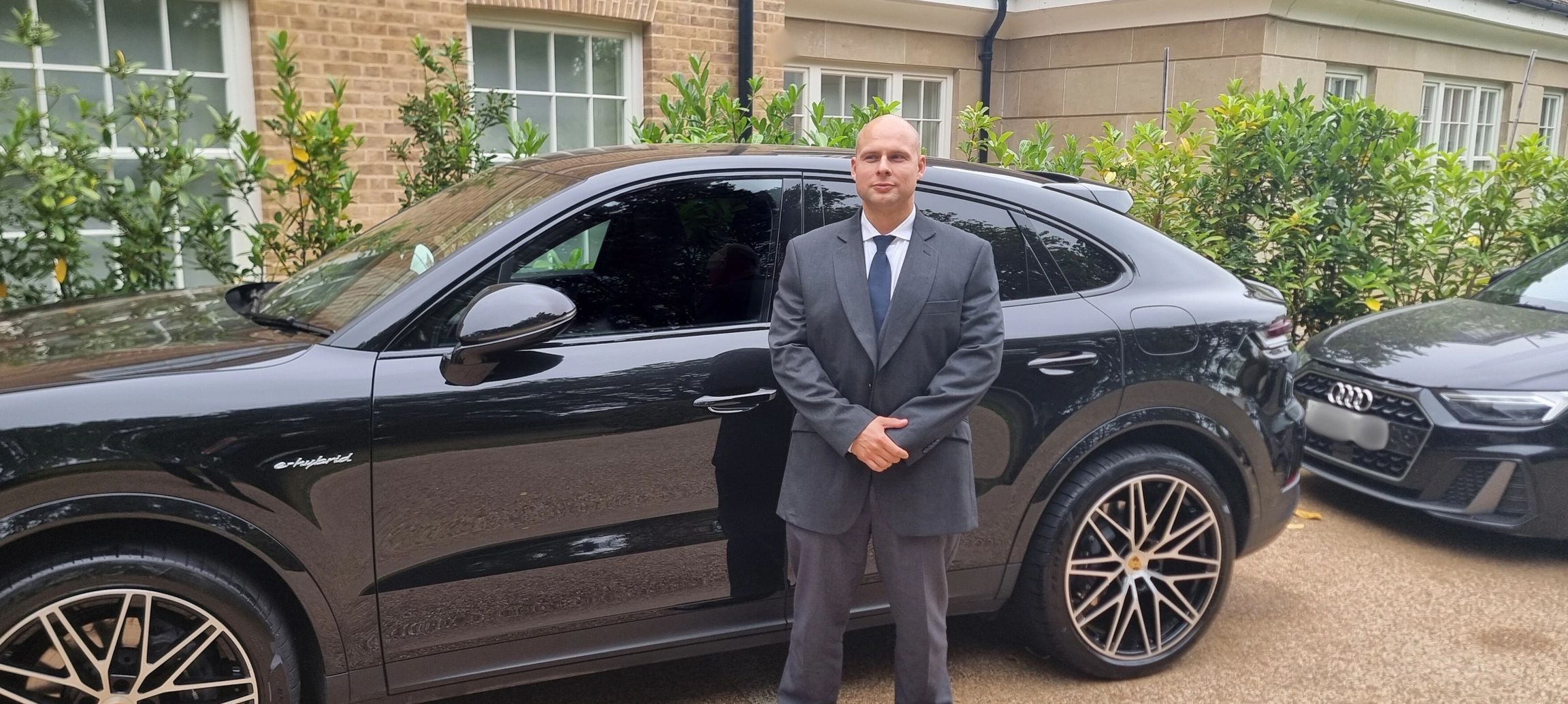 Close protection officer escorting a client during secure transport in London