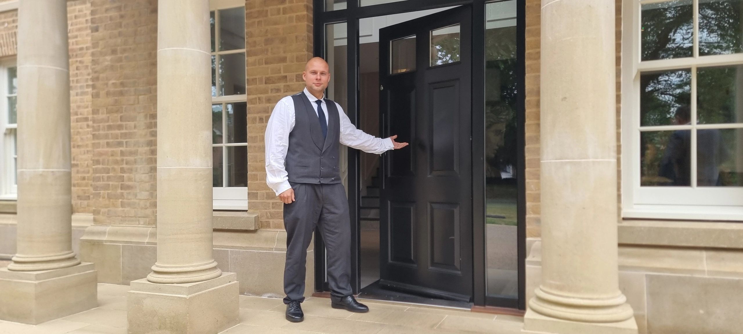 Security guard befor a professional security control room in London