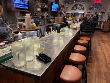 Custom zinc bar countertop installed in a restaurant bar.