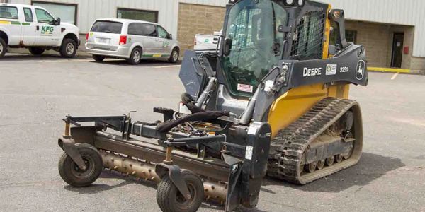 John Deere 325G compact track loader with attachment.