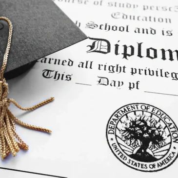 Graduation cap and diploma with Department of Education seal.