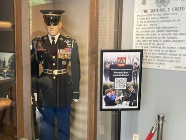 Guard mannequin in a glass display case.