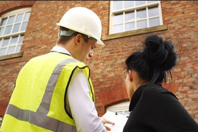 Surveying the exterior of the building