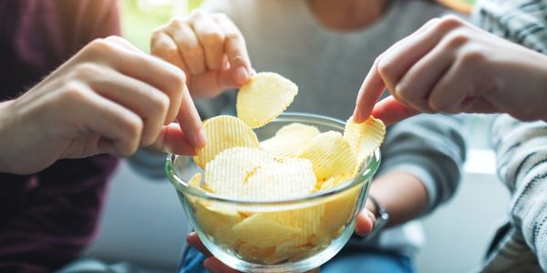 People enjoying potato chips