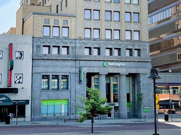 Historic Huntington bank building with classical columns in cityscape.