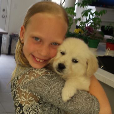 A girl with her puppy