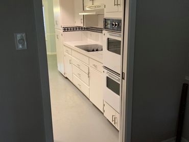 Probuild Creations LLC kitchen makeover Atlanta GA picture view of the old kitchen form dining room