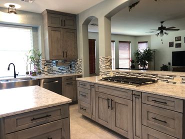 Kitchen Remodeling Marietta, GA project picture of the newly remodeled cooktop area and backsplash.