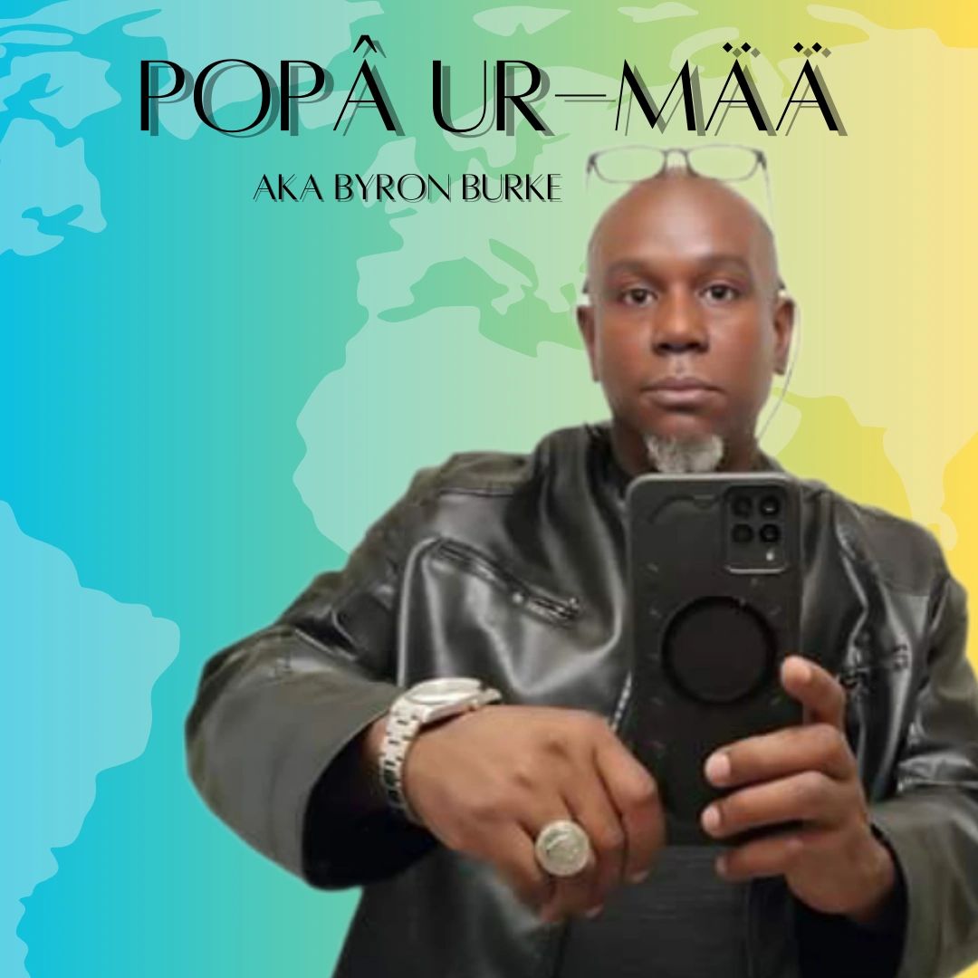 image of popa ur maa aka byron burke holding a smartphone
