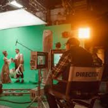 Actors perform on a green screen set with crew filming.