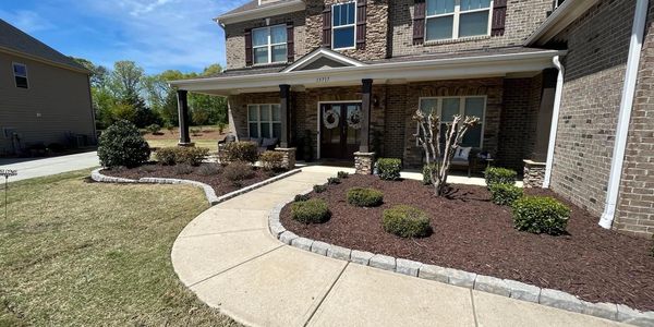 All new landscaping. Paver border, mulch, and plants.