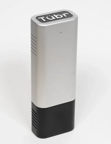 A sleek silver and black device labeled 'Tübr'.